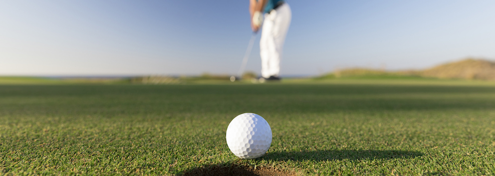 Golf ball entering the hole after successful stroke - Close up -  Links Golf