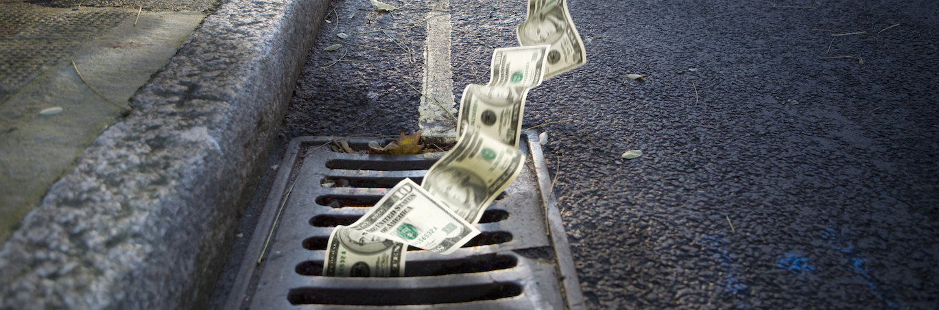 Money falling in a manhole